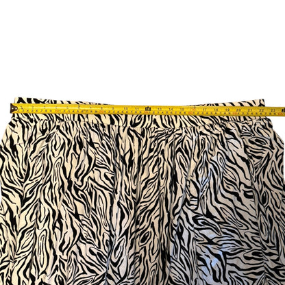 Zebra skirt fabric with a measuring tape indicating its width