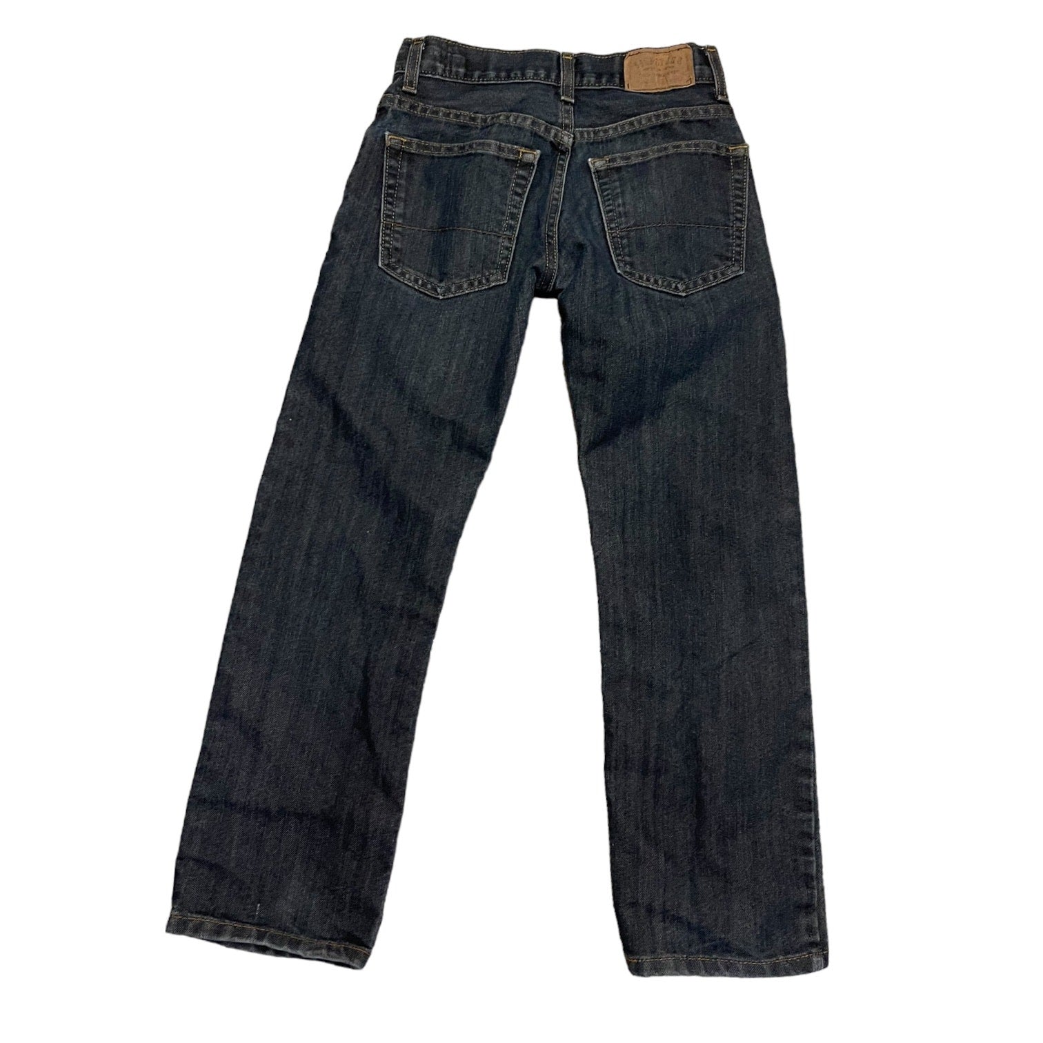 Back of a Pair of dark blue jeans on a white background