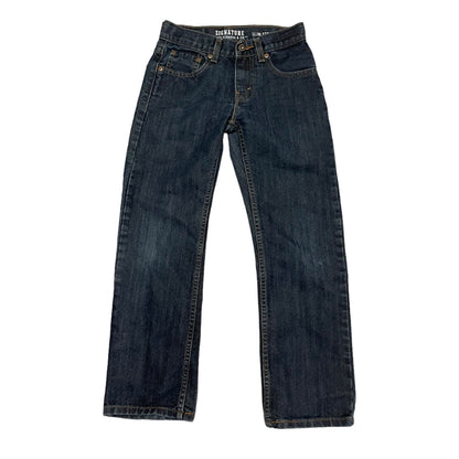 Front of a Pair of blue jeans on a white background