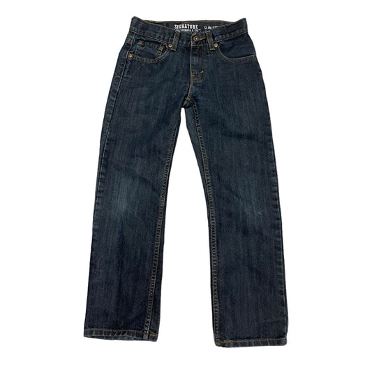 Front of a Pair of blue jeans on a white background