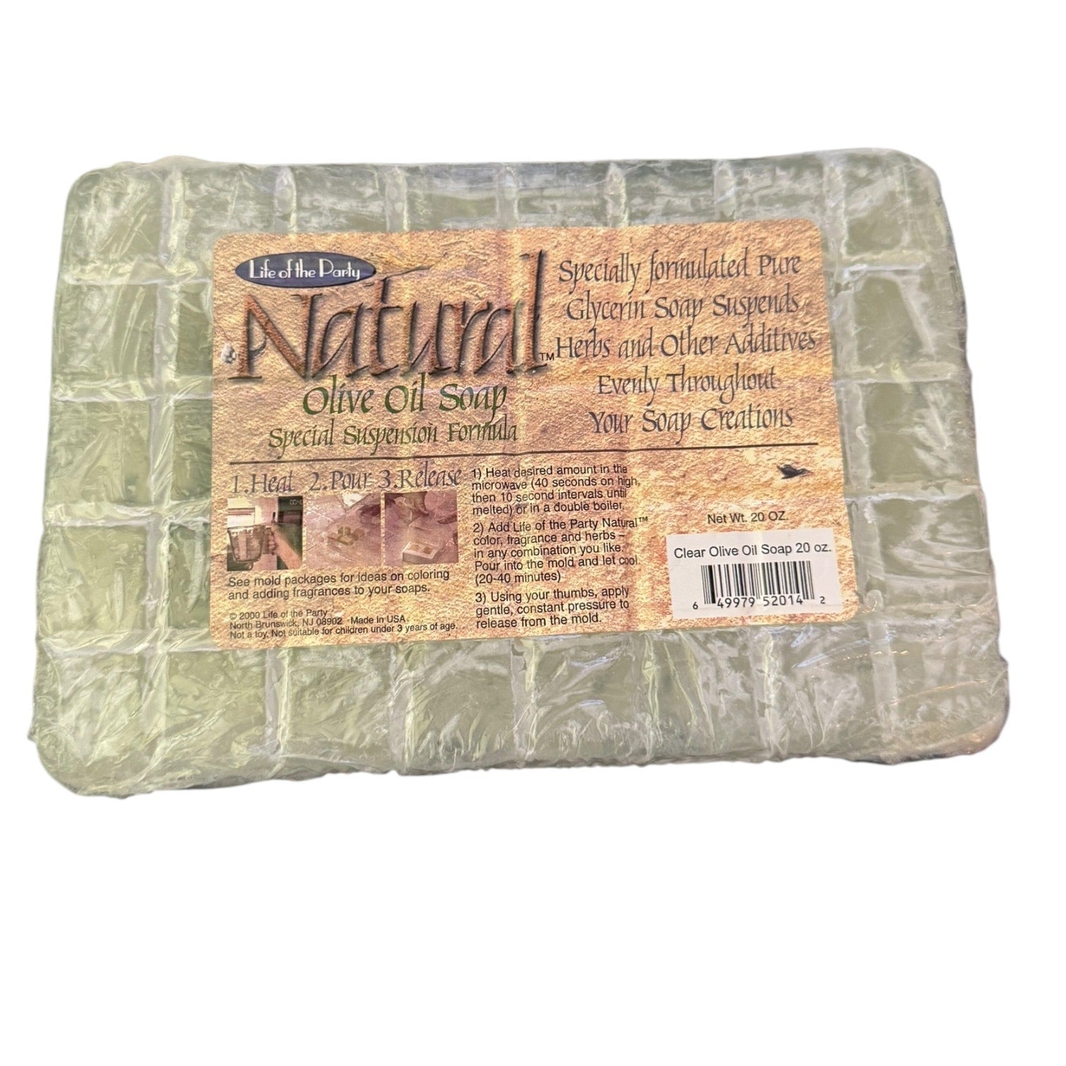 Block of natural olive oil soap with a label on a white background