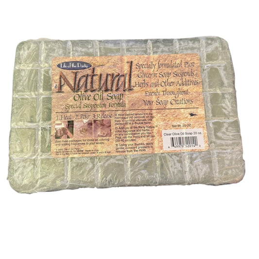 Block of natural olive oil soap with a label on a white background