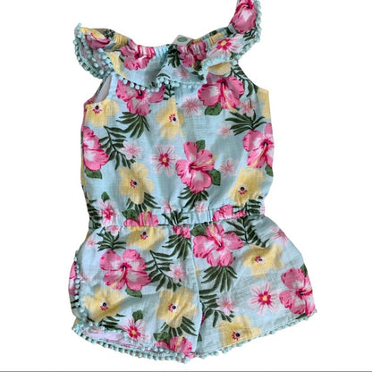Back of Floral romper with pink and yellow flowers on a light blue background