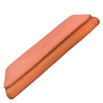 Bottom view of orange wallet on a white background