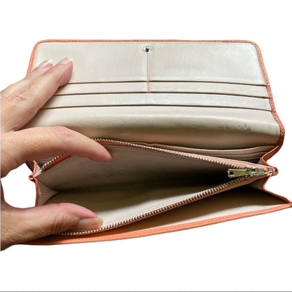 interior of wallet with the coin pocket being shown open on a white background. 