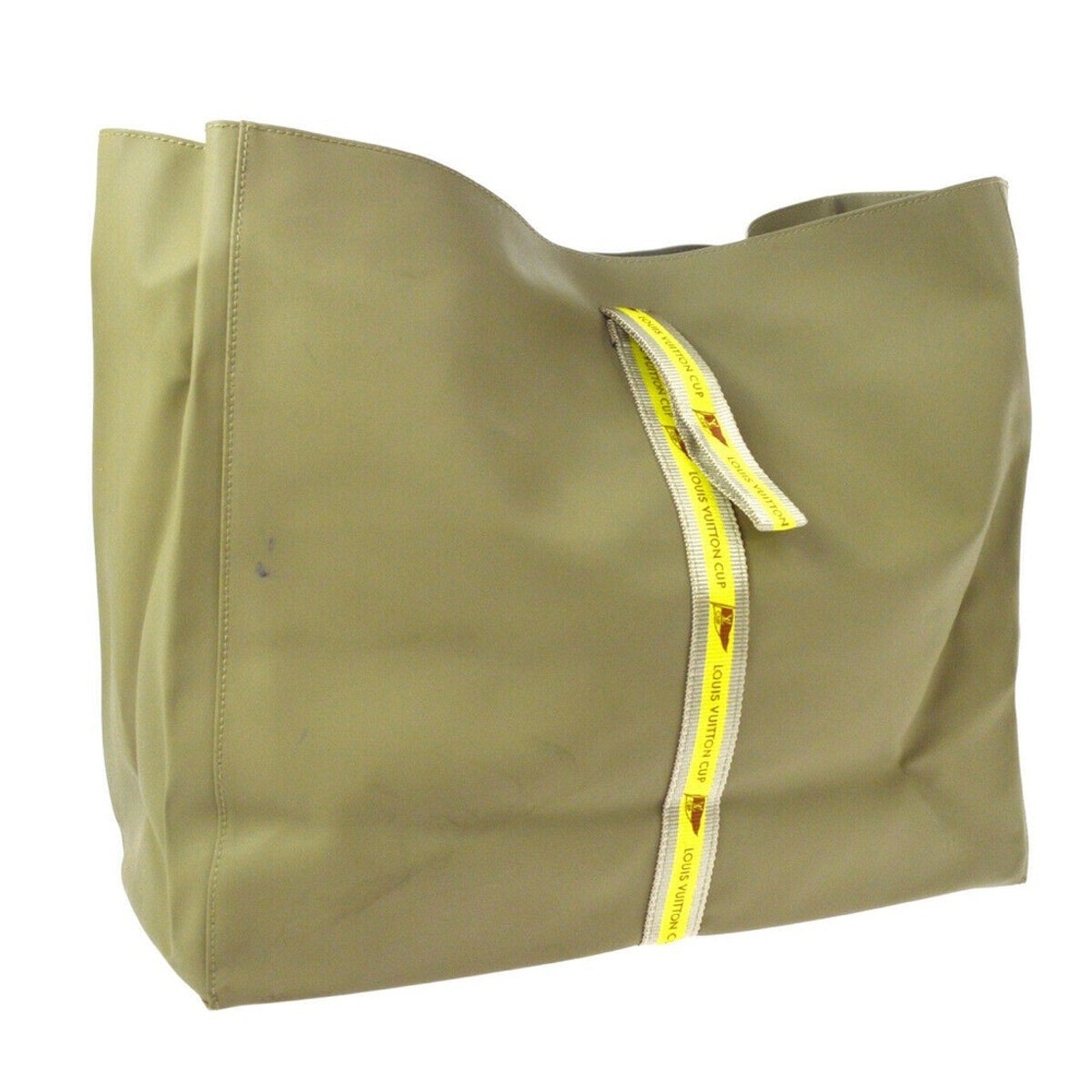 Front of grayish Green tote bag with yellow design on a white background