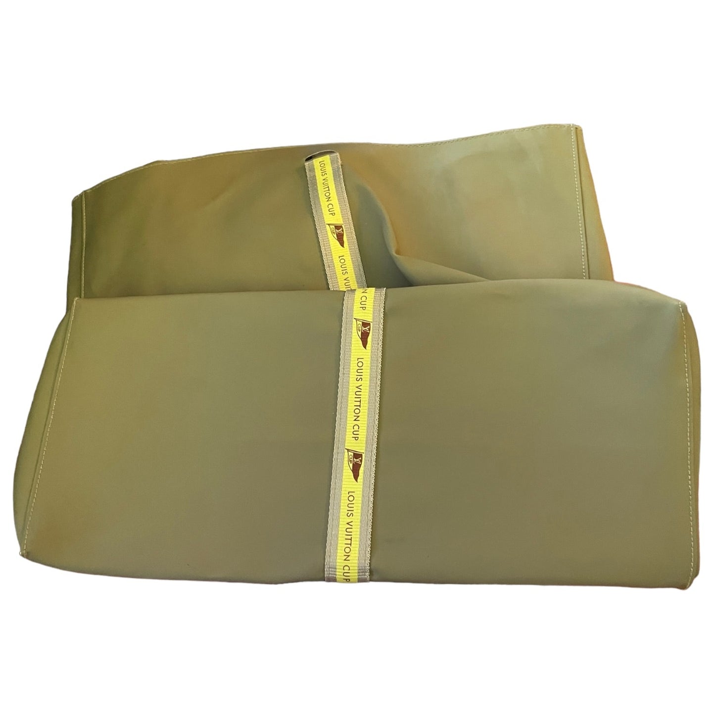 Bottom of tote with yellow stripe saying Louis Vuitton Cup on a white background