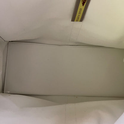 interior of tote with a visible Louis Vuitton label.