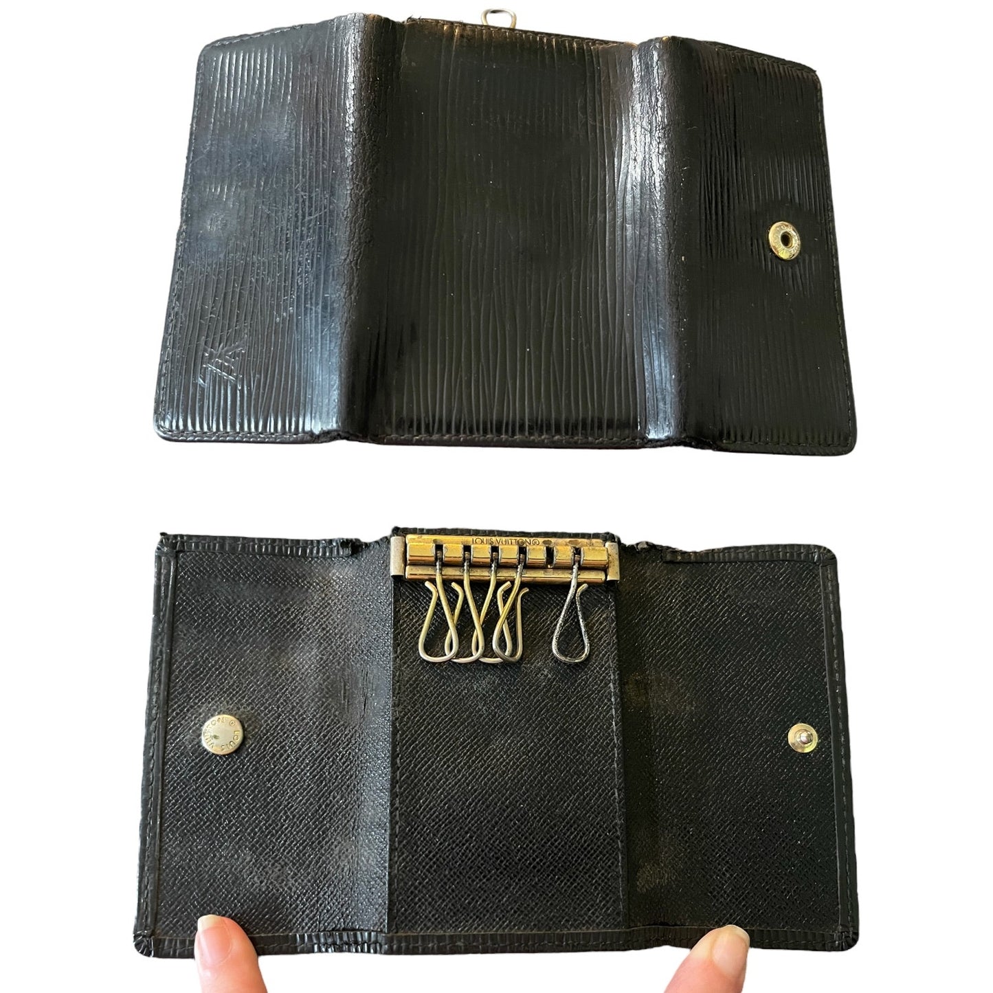 Front and back of black key chain