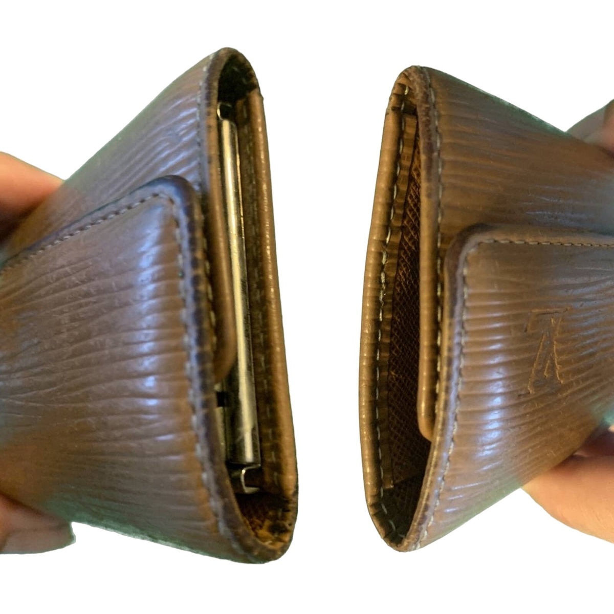 A brown textured leather wallet shown from two angles, held by hands against a plain white background to demonstrate its interior capacity.