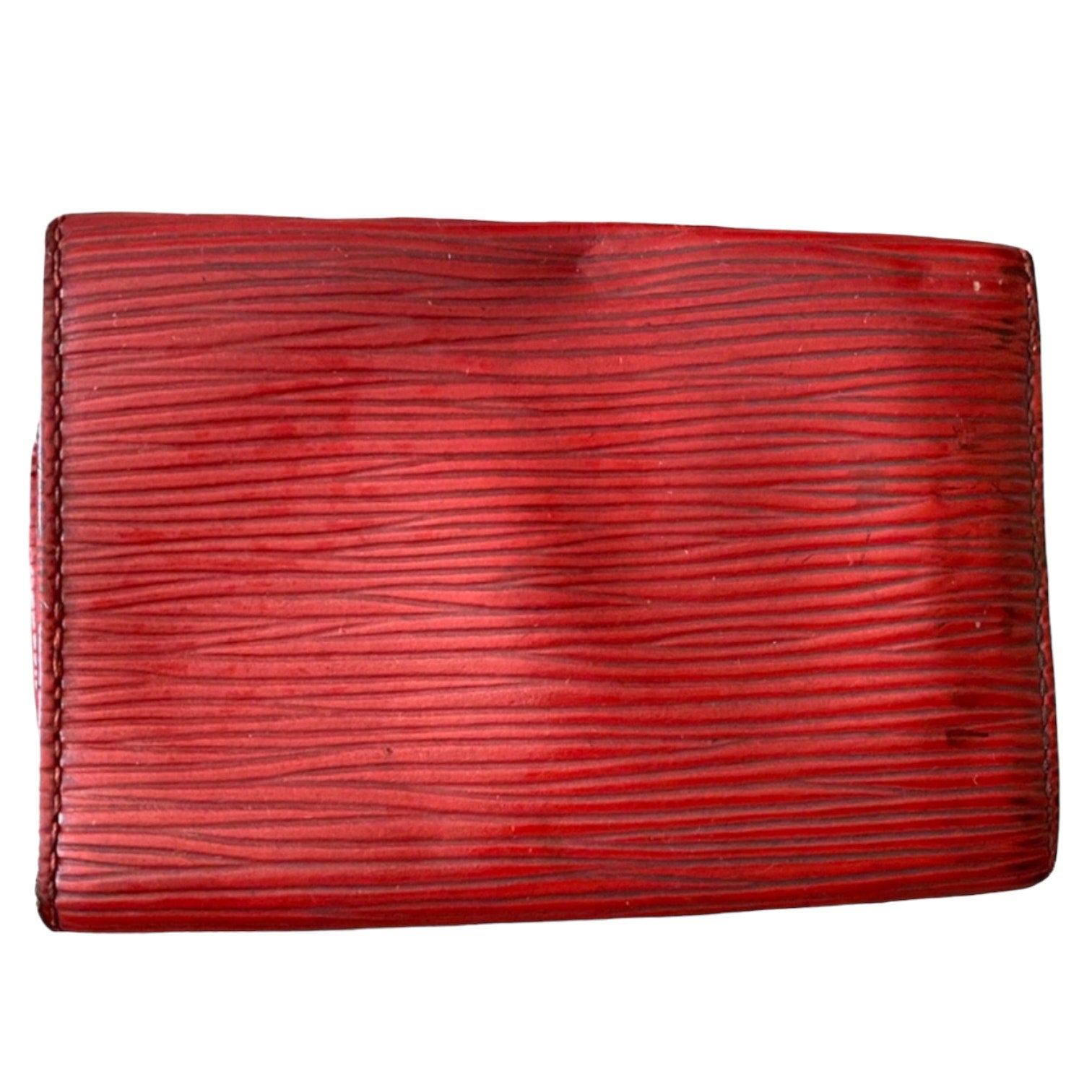 A red textured leather key wallet with horizontal grain, shown flat against a plain white background.