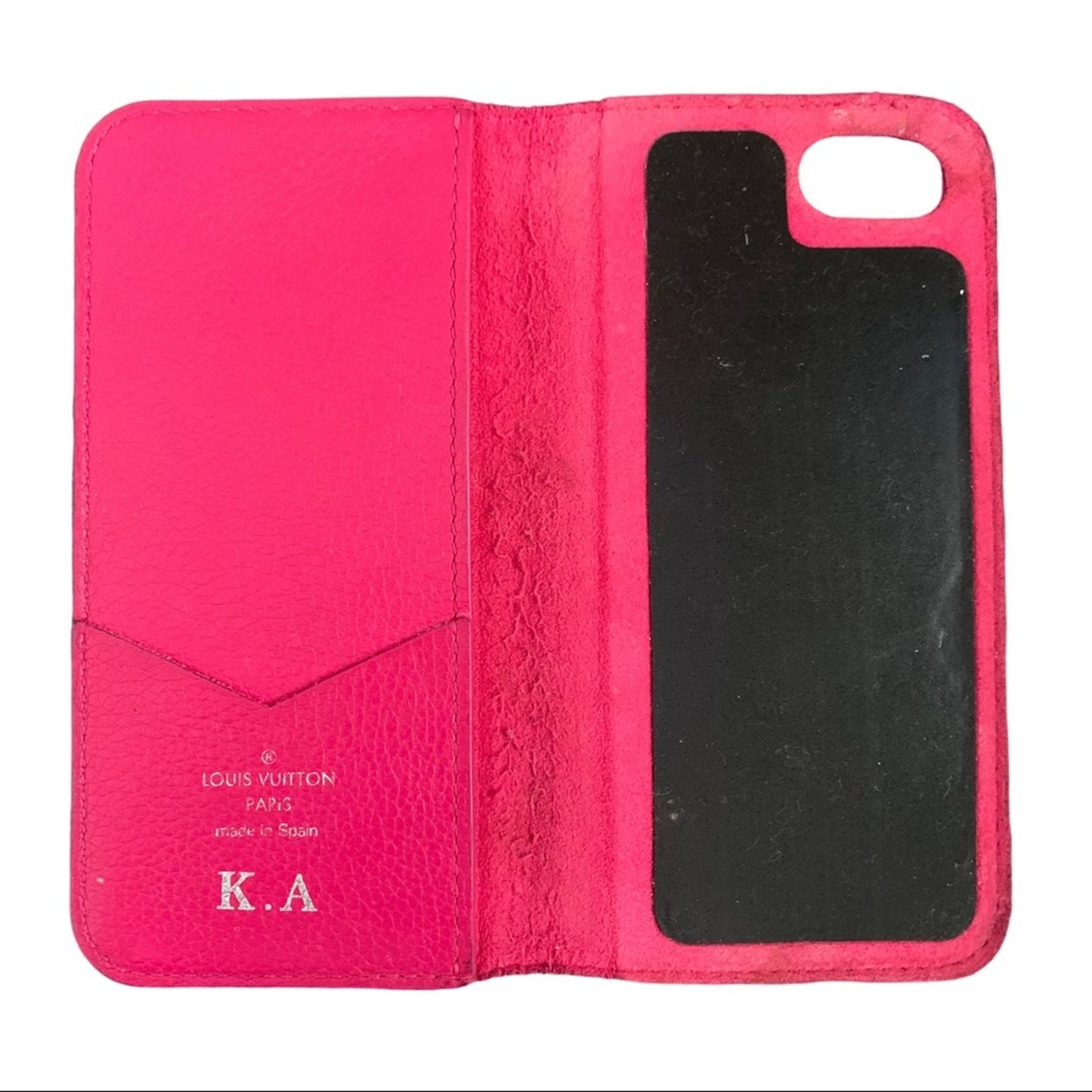Pink phone case interior with visible branding on a white background
