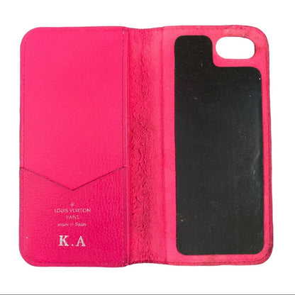 Pink phone case interior with visible branding on a white background