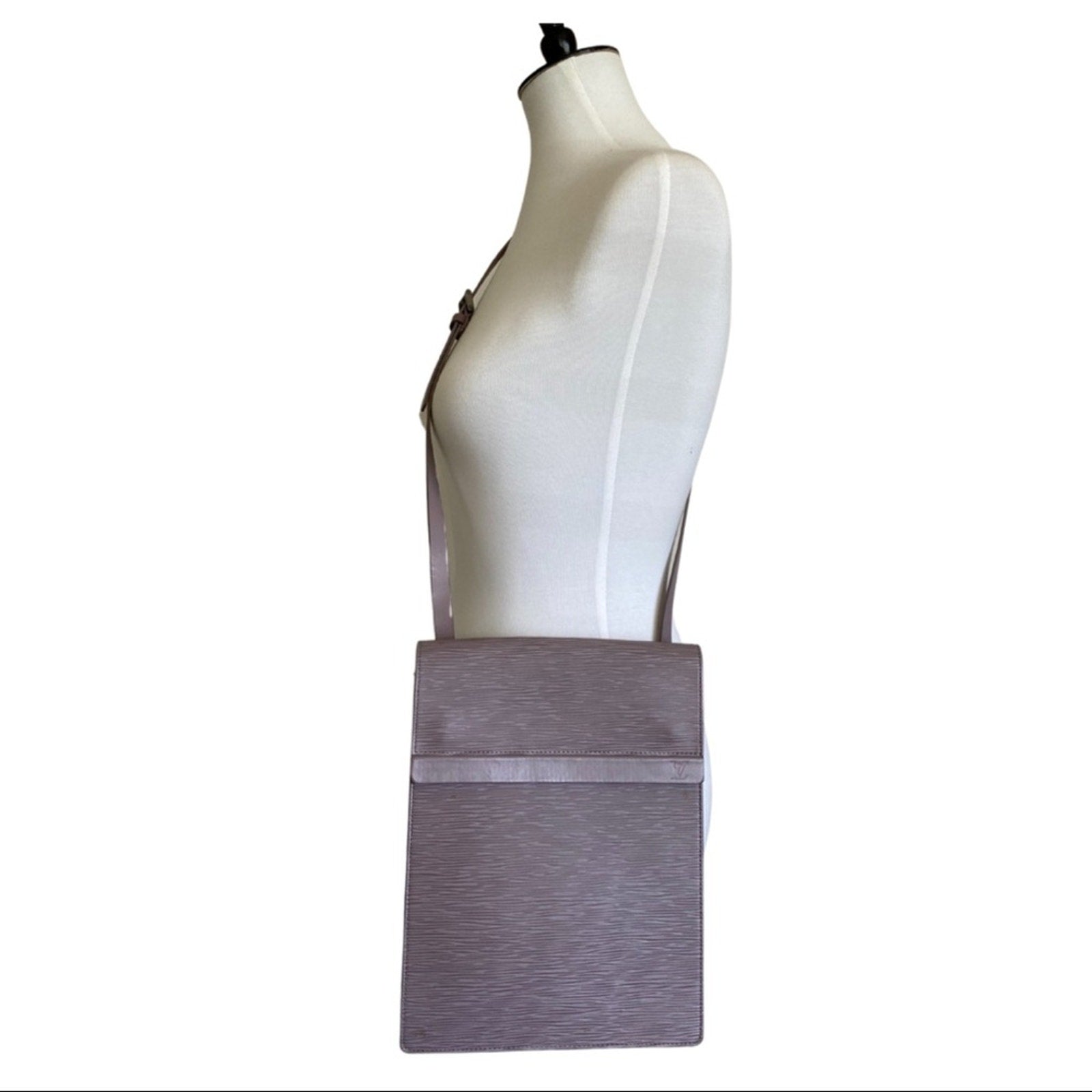 Mannequin with purple purse on a white background