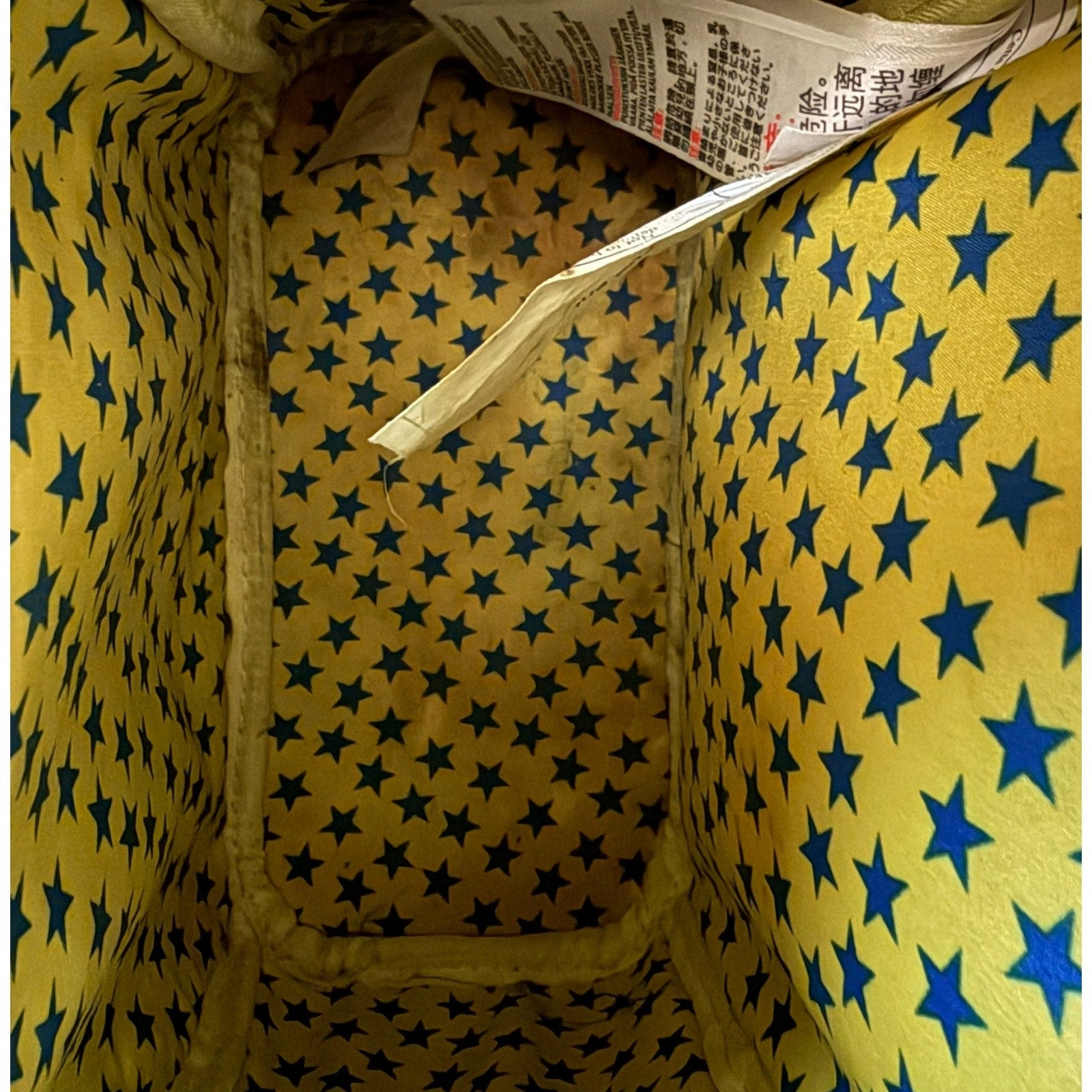 Yellow fabric with blue star pattern and a interior tag