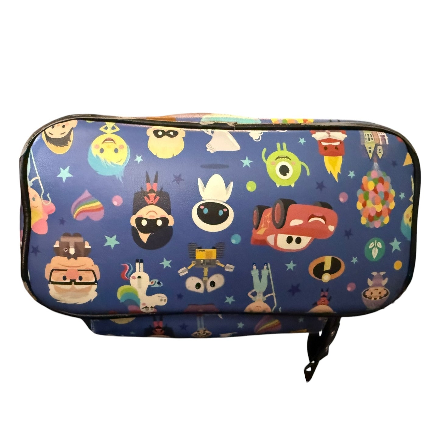 Bottom of blue backpack with cartoon character pattern on a white background
