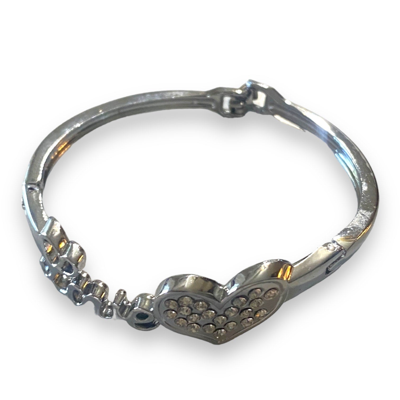 Top of Silver bracelet with heart design on a white background