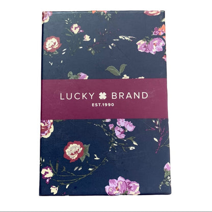 Floral-patterned product packaging with 'Lucky Brand' label on a white background