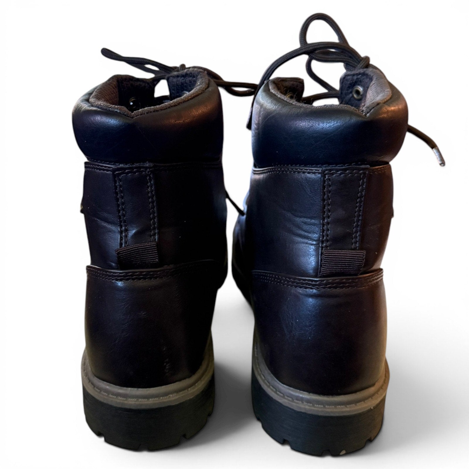 Pair of brown leather boots on a white background