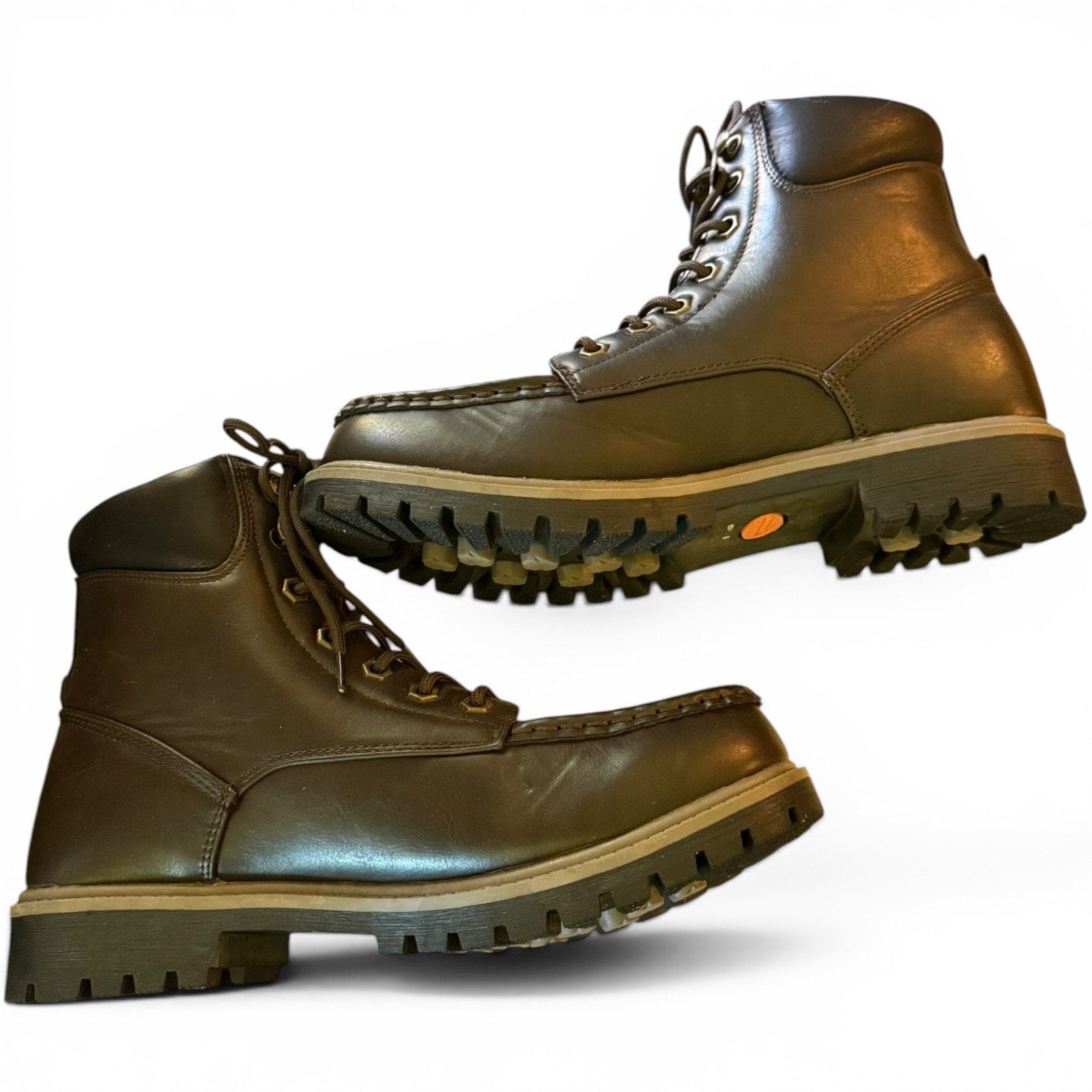 Pair of brown leather boots on a white background