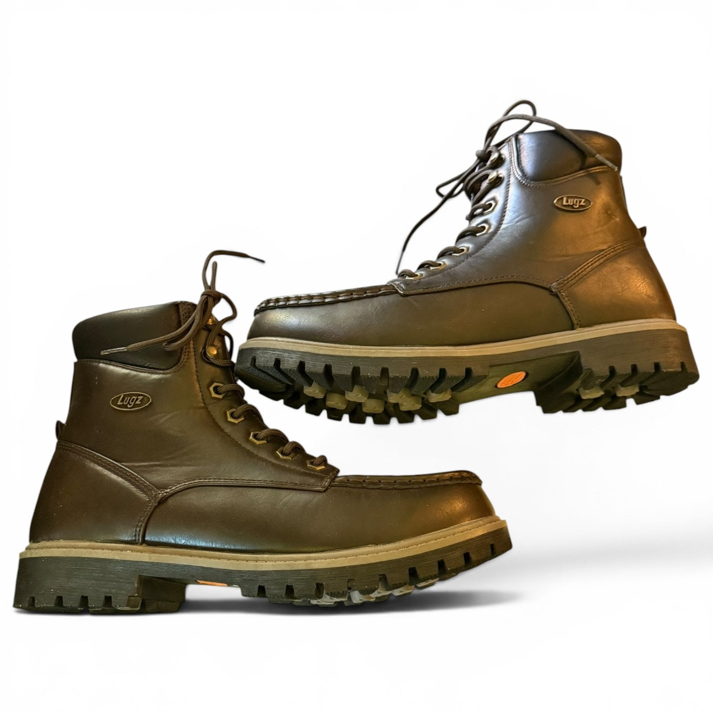 Pair of brown hiking boots with visible brand logo on a white background