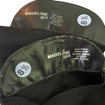 Close-up of the interior of boots with a peeling issues with 'MADELINE girl' and size sticker '8 1/2'.
