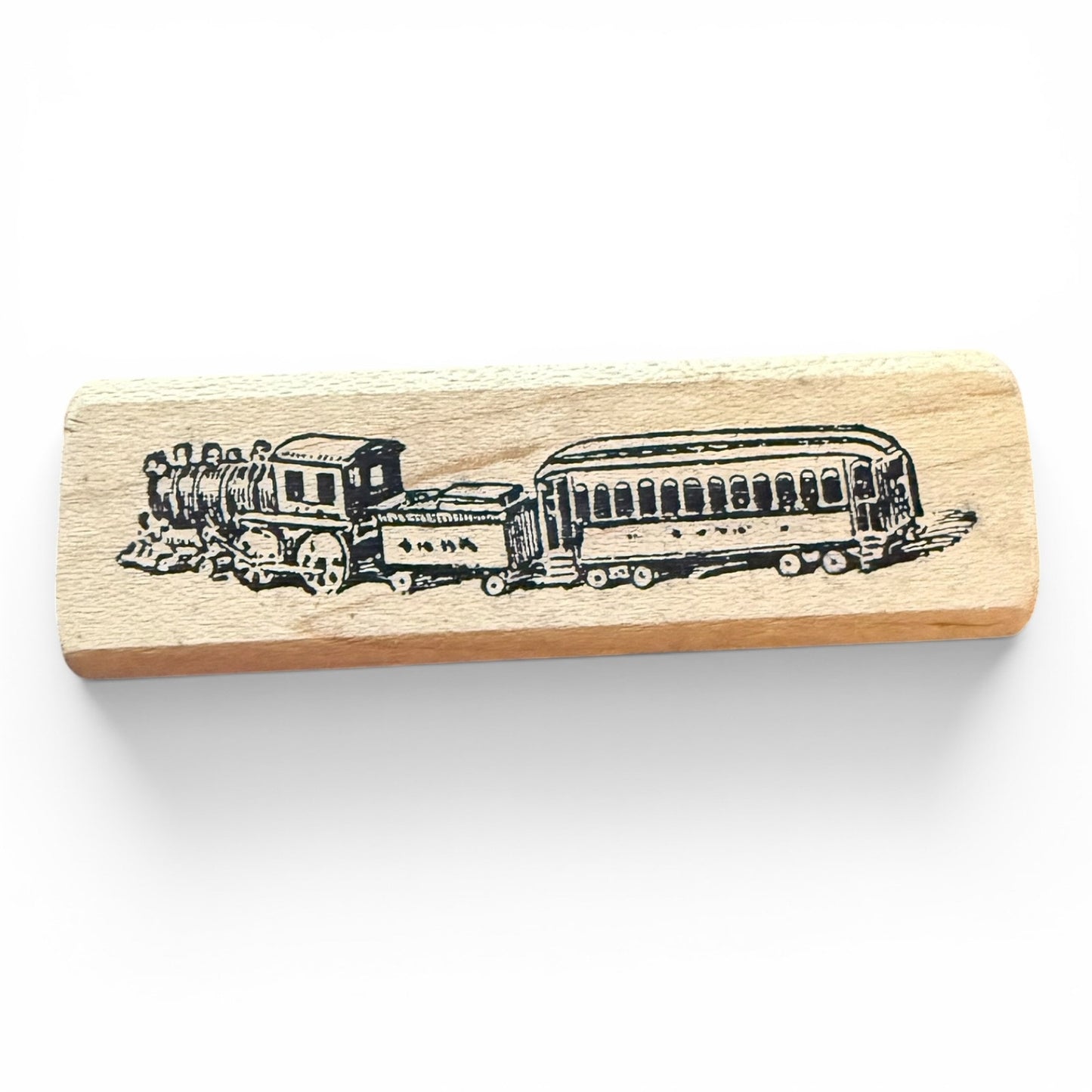 Wooden stamp with a train design on a white background