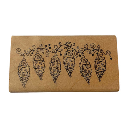 Wooden stamp with decorative design on a white background