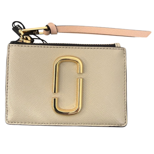 Beige wallet with gold clasp and pink strap on a white background