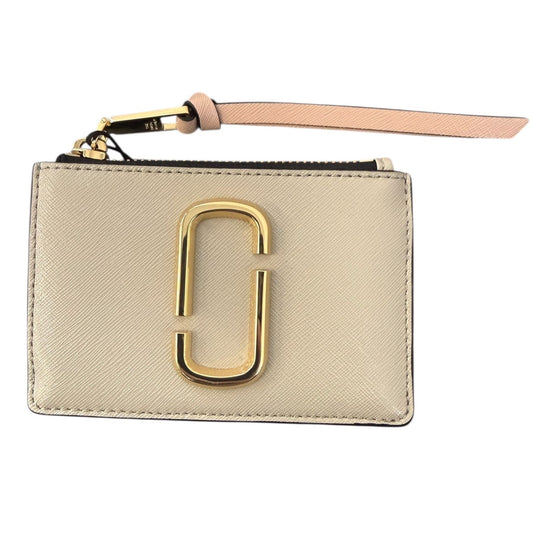 Beige wallet with gold clasp and pink strap on a white background