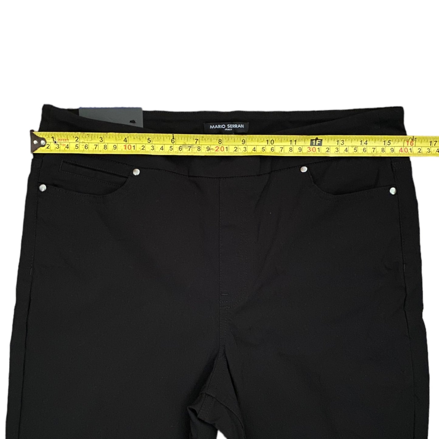 Black pants with a measuring tape on a white background