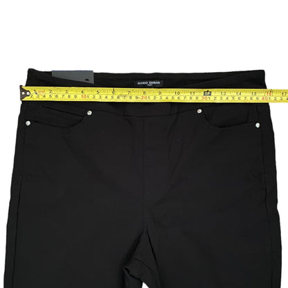 Black pants with a measuring tape on a white background