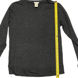Dark gray long-sleeve shirt with a measuring tape on a white background
