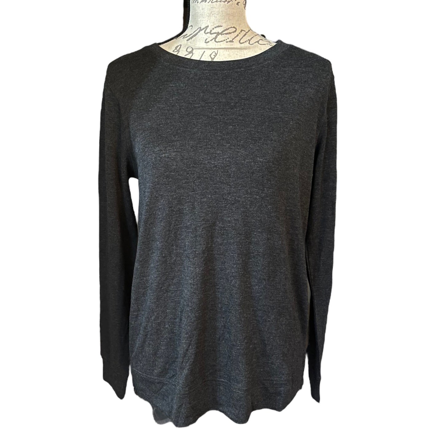 Front of Dark gray long-sleeve top on a mannequin against a white background