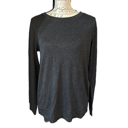 Front of Dark gray long-sleeve top on a mannequin against a white background