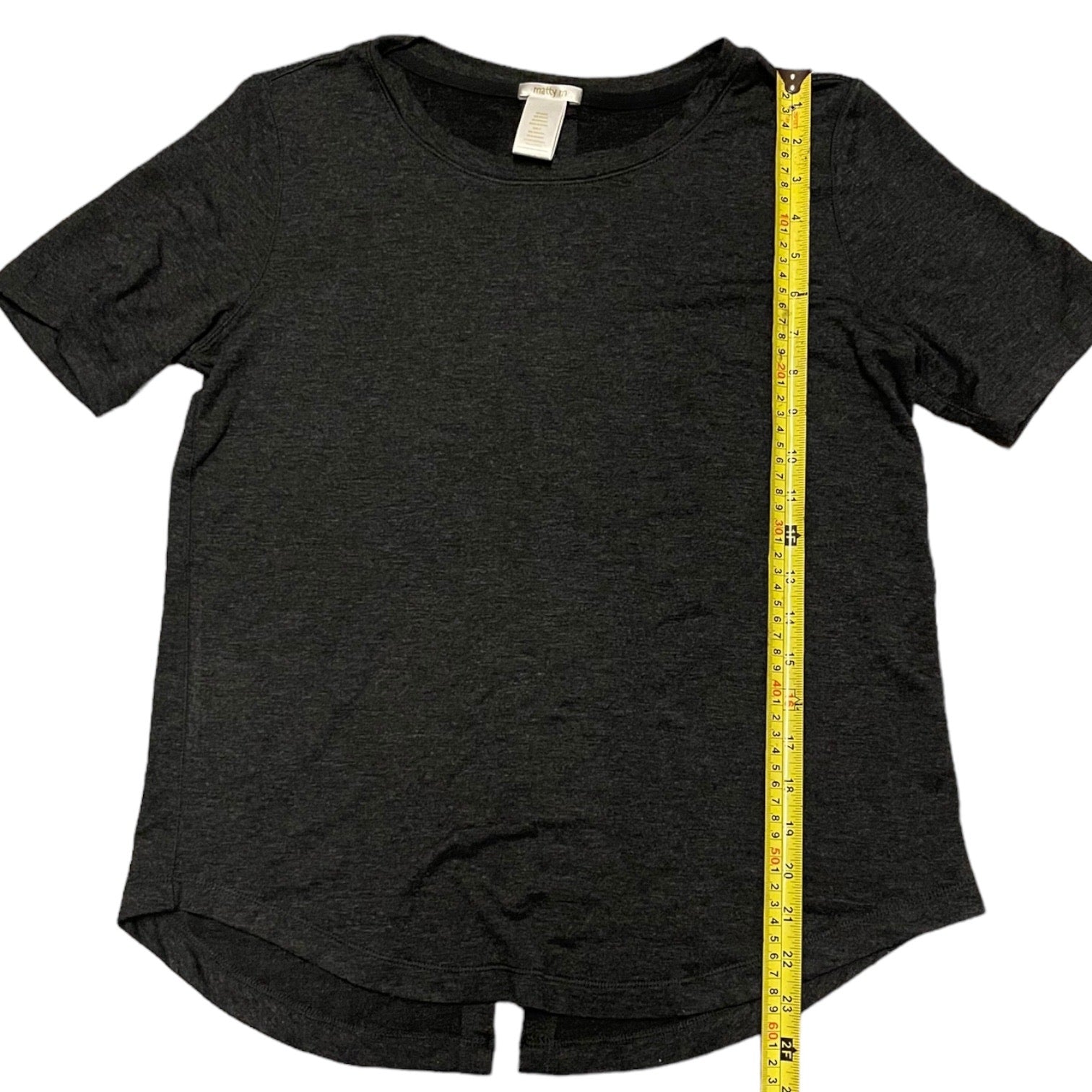 Black t-shirt with a yellow measuring tape on a white background