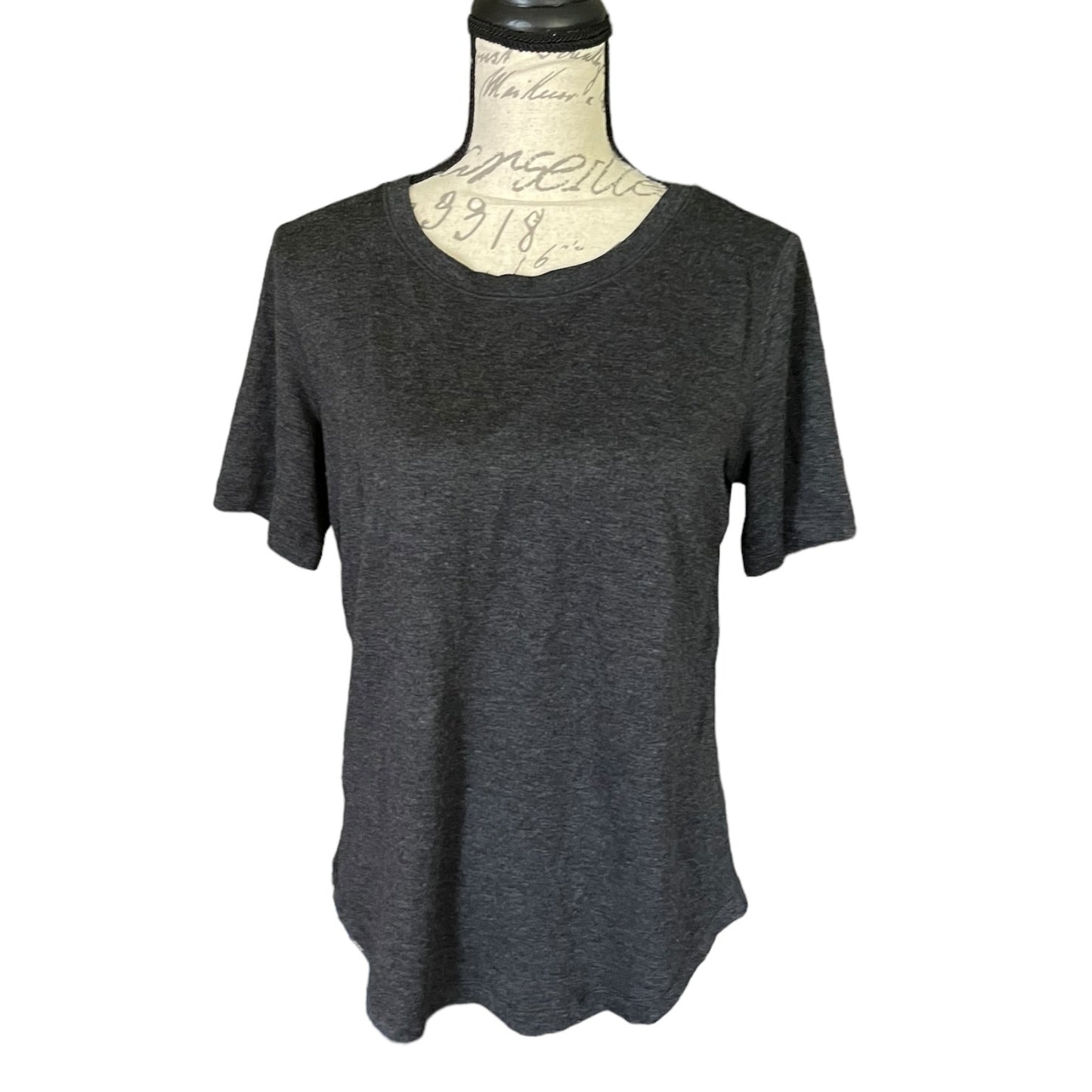 Front of Dark gray t-shirt on a mannequin with a white background