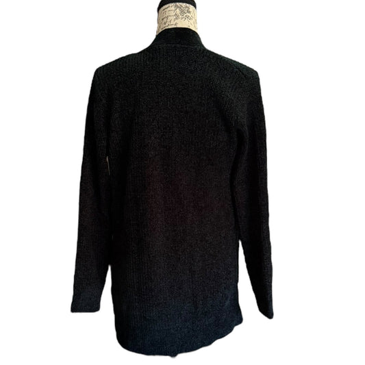 Back of cardigan sweater on a mannequin against a white background