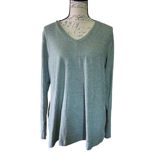 Front of green long-sleeve shirt on a mannequin against a white background