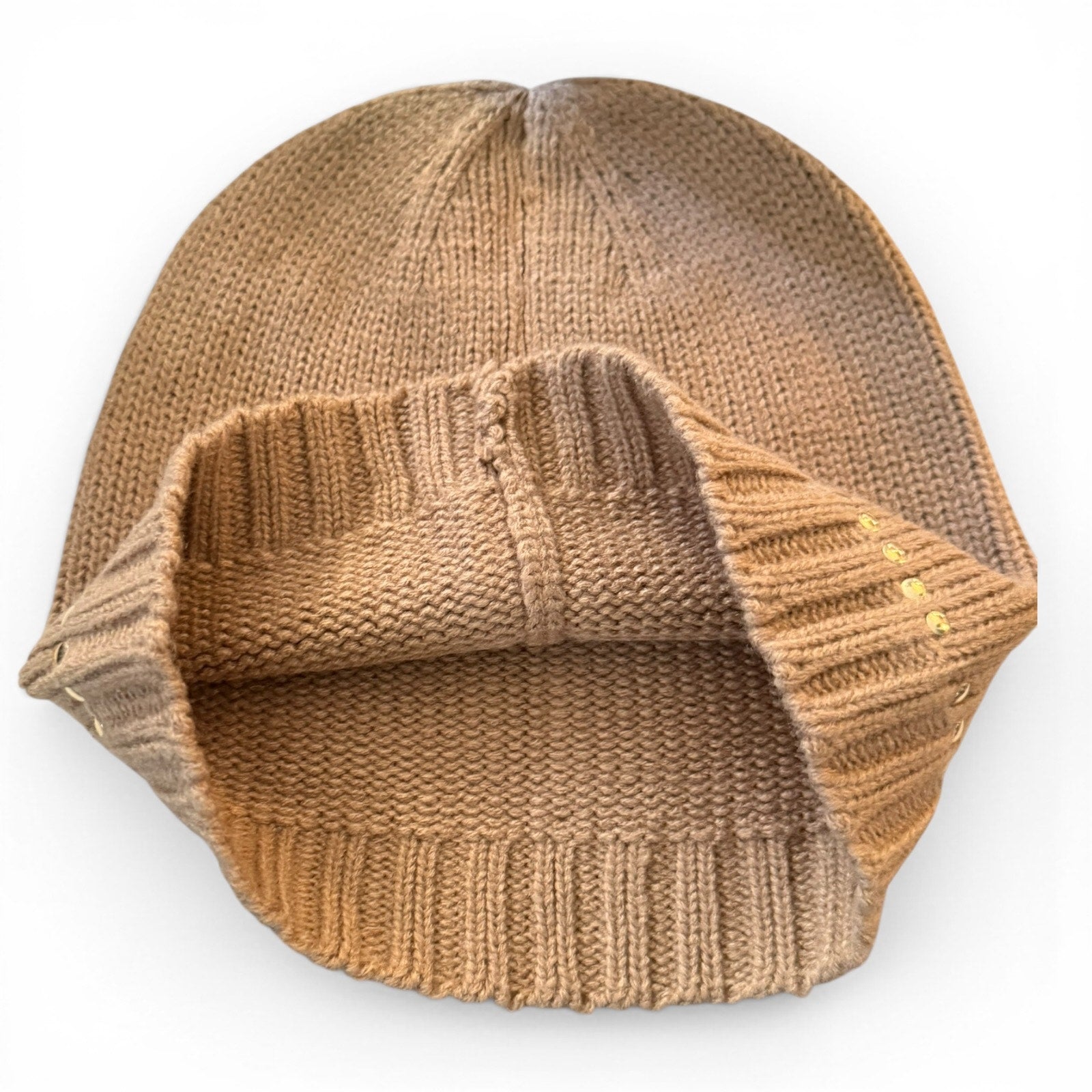 Beige knit beanie on a white background
