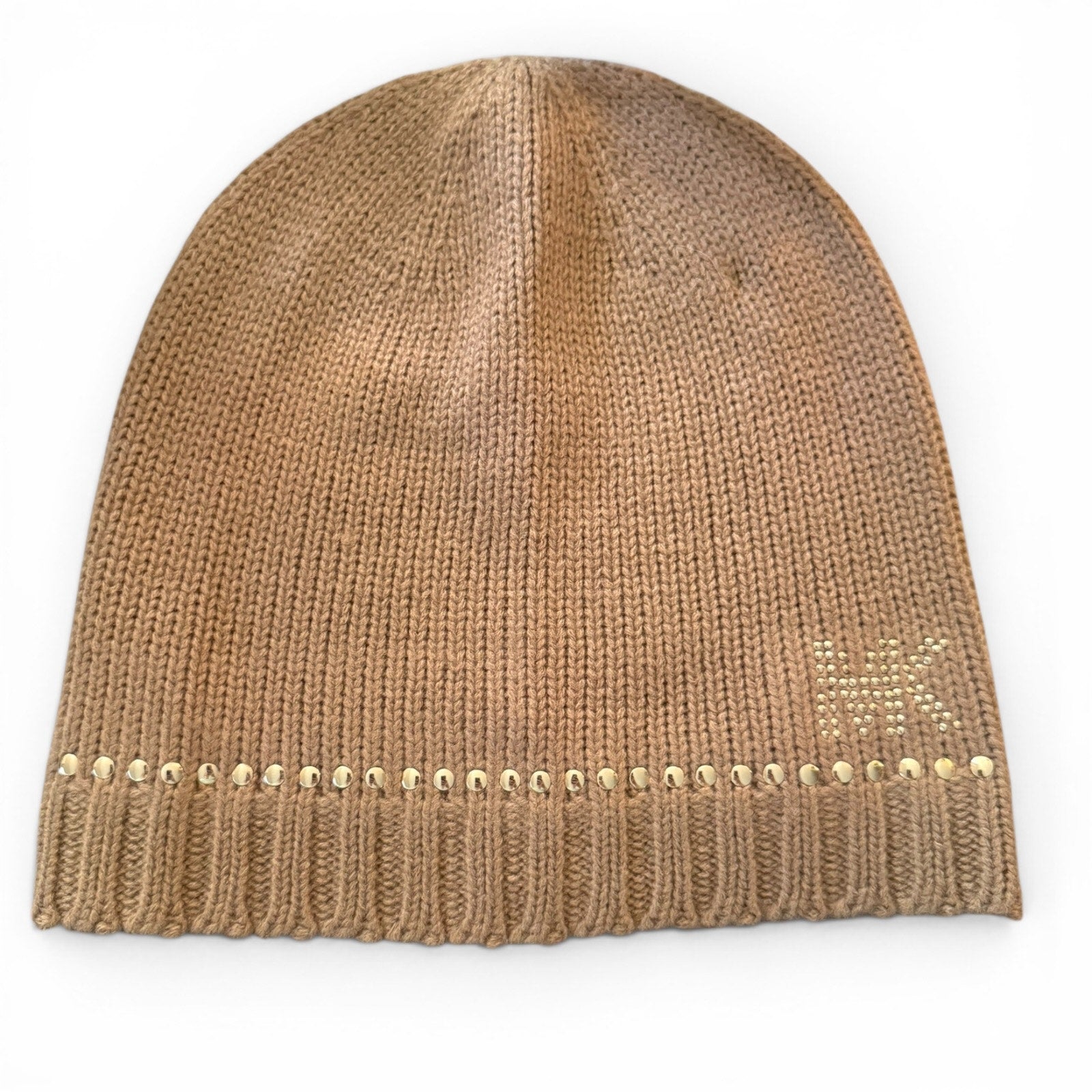Beige knit beanie with decorative studs on a white background