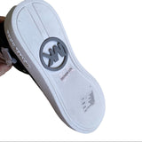 Bottoms of black Michael Kors sneakers