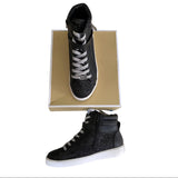 Side and front of black Michael Kors sneakers