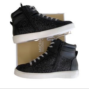 Side 1 of black Michael Kors sneakers