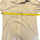 Striped shirt with a measuring tape across it on a white background