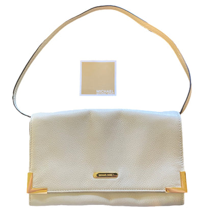 Off White handbag with gold accents and a visible brand label on a white background