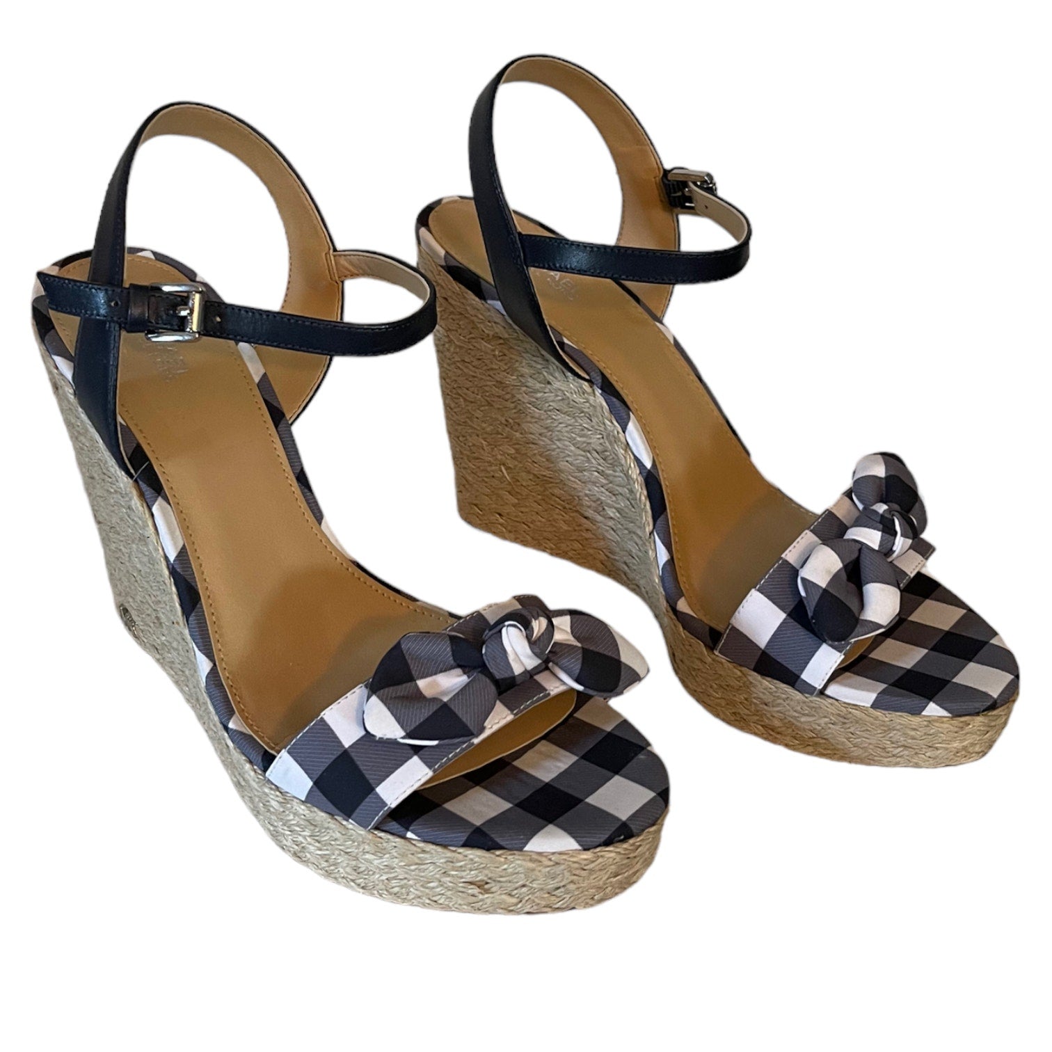 Front of Wedge sandals with checkered straps and bow details on a white background