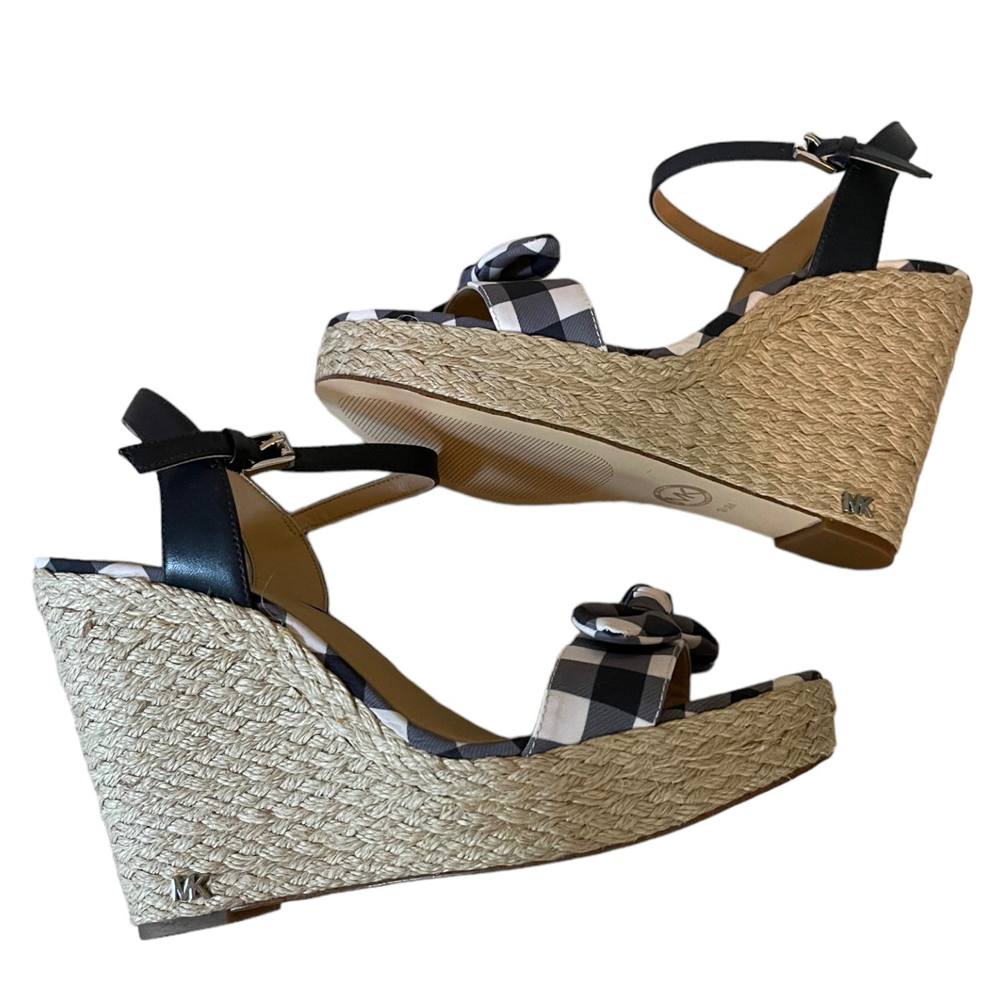 A pair of women's wedge sandals with woven jute wedge heels, ankle straps, and a gingham bow detail on the toes, shown against a plain white background.