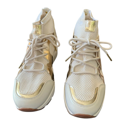 A pair of white and gold high-top sneakers shown from the front on a plain white background.
