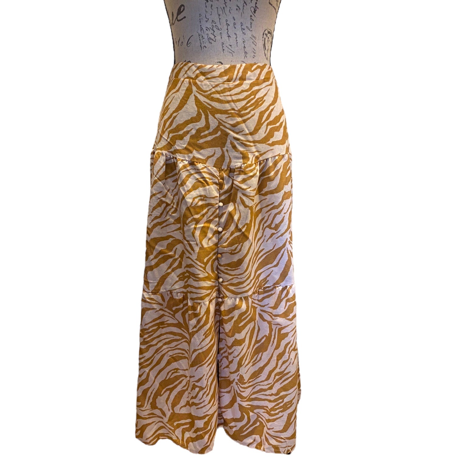 Front of zebra patterned skirt on a mannequin against a white background
